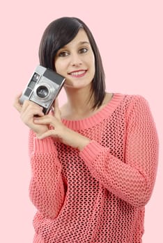 pretty young brunette woman with an antique camera