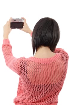 pretty young brunette woman with an antique camera