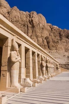 The temple of Hatshepsut near Luxor in Egypt.  Statues on facade of palace of Hatshepsut