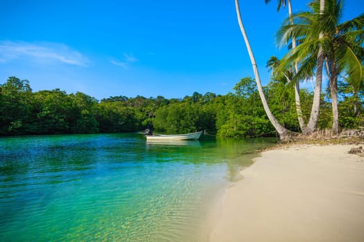 Boat on the beach. Vacation holidays background.  tropical beach