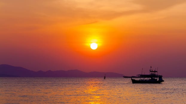 Beautiful landscape. sunset on the beach with fishing boat