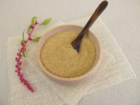 Amaranth grains in a wooden bowl
