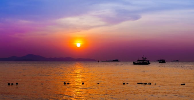 Beautiful landscape. sunset on the beach with fishing boat