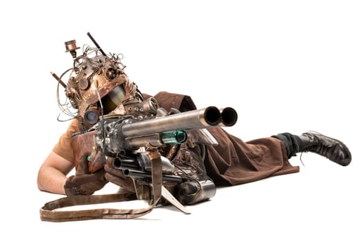Futuristic soldier posing with gun and armor isolated in white