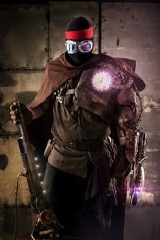 Futuristic soldier posing with gun and armor