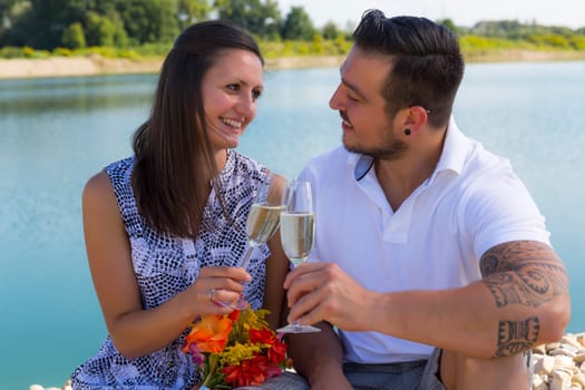 Happy young couple with champagne glasses,engagement,Bavaria,Germany