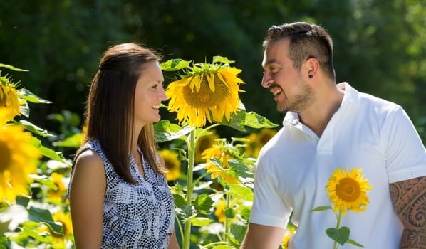 Happy young couple in the sunflower field,engagement,Bavaria,Germany