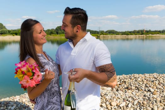 Happy young couple with champagne glasses,engagement,Bavaria,Germany