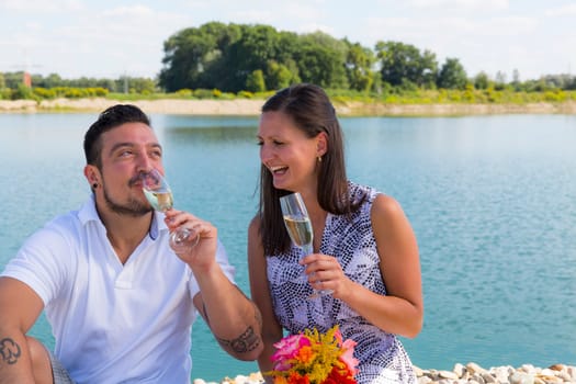 Happy young couple with champagne glasses,engagement,Bavaria,Germany