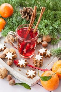 A cup of tea with cinnamon and places