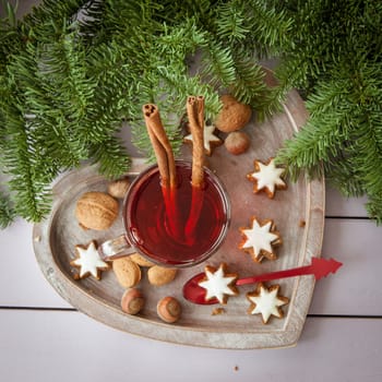 A cup of tea with cinnamon and places