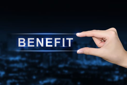hand pushing benefit button on blurred blue background