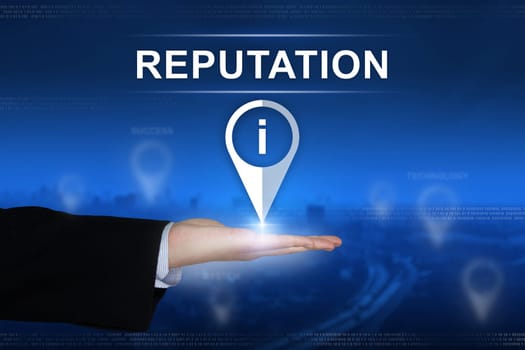 reputation button with business hand on blurred background