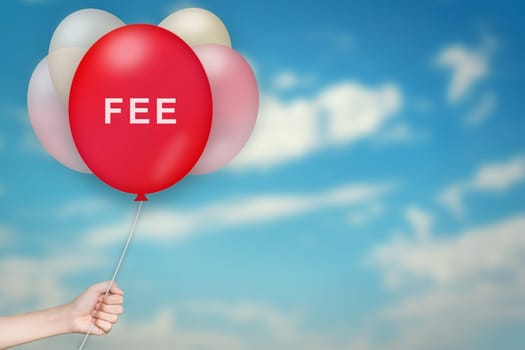 Hand Holding Fee Balloon with sky blurred background