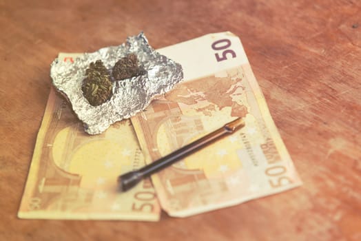 close up of marijuana,pipe and euro money,vintage effect
