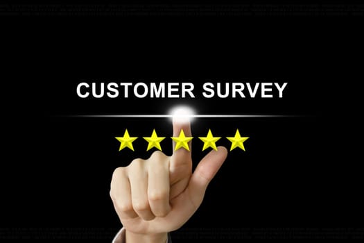business hand clicking customer survey with five stars on screen