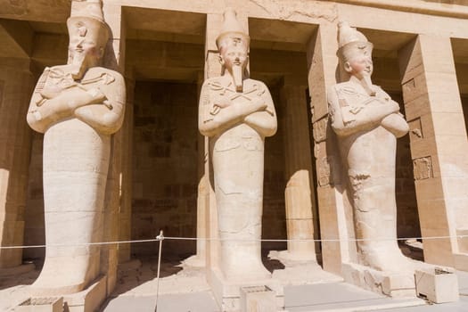 The temple of Hatshepsut near Luxor in Egypt.  Statues on facade of palace of Hatshepsut