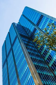Blue skyscraper facade. office buildings. modern glass silhouettes of skyscrapers