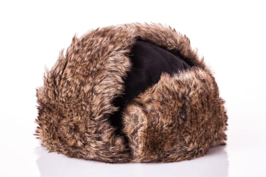 Fur cap for winter weather. Fur cap for winter isolated on white background