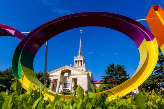 Commercial Sea Port of Sochi and beautiful tropical garden with palm trees.  Port cityscape square