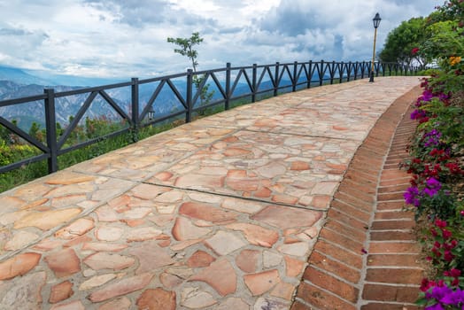 Paved flower lined path in Chicamocha Canyon near Bucaramanga, Colombia