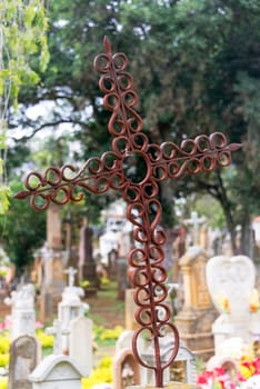 Old rusty cross in the cemetery of Barichara, Colombia