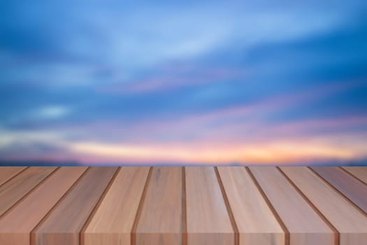 Empty top of wooden table with sunset background. For product display