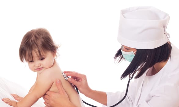 Young female Doctor checking baby with stethoscope on white background