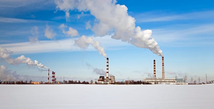 emissions of industrial enterprises in the frosty winter day.