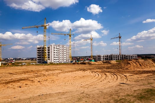 a construction site on which construction of a new multystoried house is carried out.