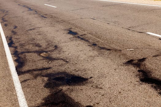 photographed close-up part of the road that has been spoiled with time