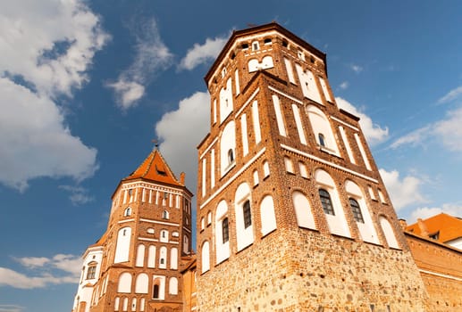ancient fortress of the 16th century photographed close-up, located in the town of Mir, Belarus. Summer time of the year, against a blue sky.
