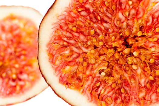 photographed on a white background raw ripe figs, cut in half
