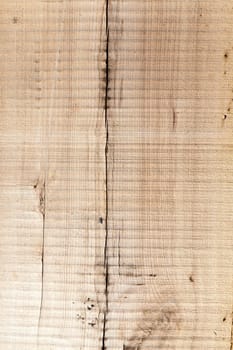 cracked board used as a building material, close-up, visible damage after treatment