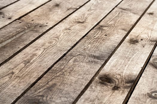 photographed wooden surface made of planks. Part of the old building structure