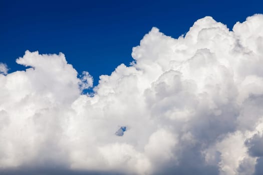 photographed close-up white clouds are in the blue sky, shallow depth of field
