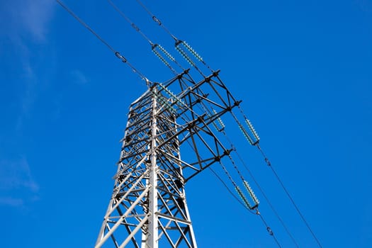 photographed close-up, high-voltage electric poles located in the countryside