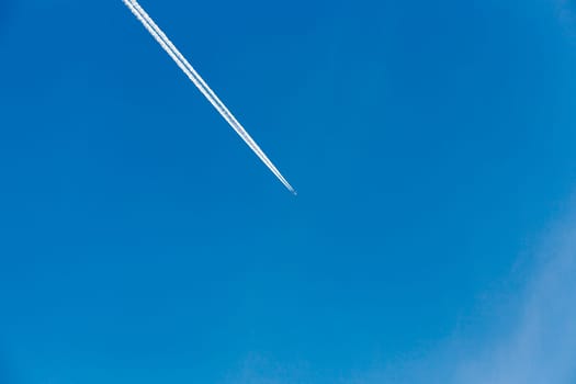 photographed close-up of a blue sky with clouds located on it, flying plane