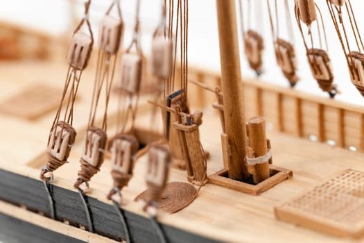 photographed close-up of a model sailing ship, made by hand from the tree, a small depth of field