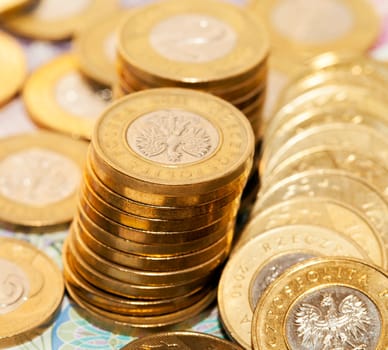 photographed close-up Polish coins. Zloty stacked together, shallow depth of field