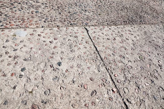 photographed close-up of the pedestrian road made of concrete tiles