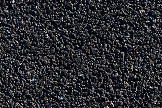 photographed close-up of the new road for the movement of vehicles, a dark cover the carriageway