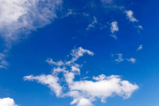 photographed close-up white clouds are in the blue sky, shallow depth of field