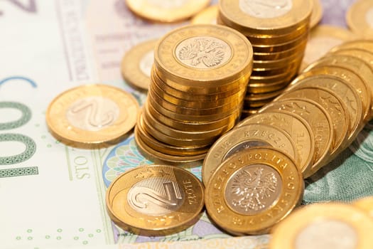 photographed close-up Polish coins. Zloty stacked together, shallow depth of field