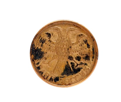 isolated on white background old Russian ruble coin is covered with rust and black crust