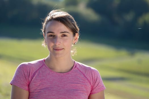 portrait of a young sporty woman in the countryside