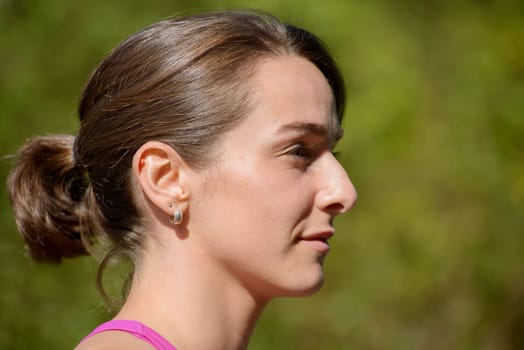 portrait of beautiful young woman in the countryside