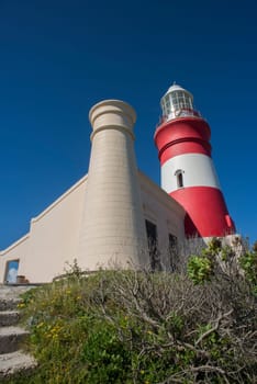 A side view of the lighthouse at Cape Agulhas showing one of the two tower.