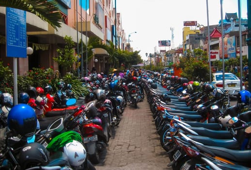 Yogyakarta, Indonesia - January 03, 2012: View of Yogyakarta with its typical hundreds of motorbikes on Yogyakarta, Indonesia. There is nearly 1 million of motorbikes in the whole city.