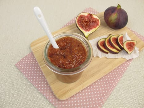 Homemade fig mustard in the glass and fresh figs